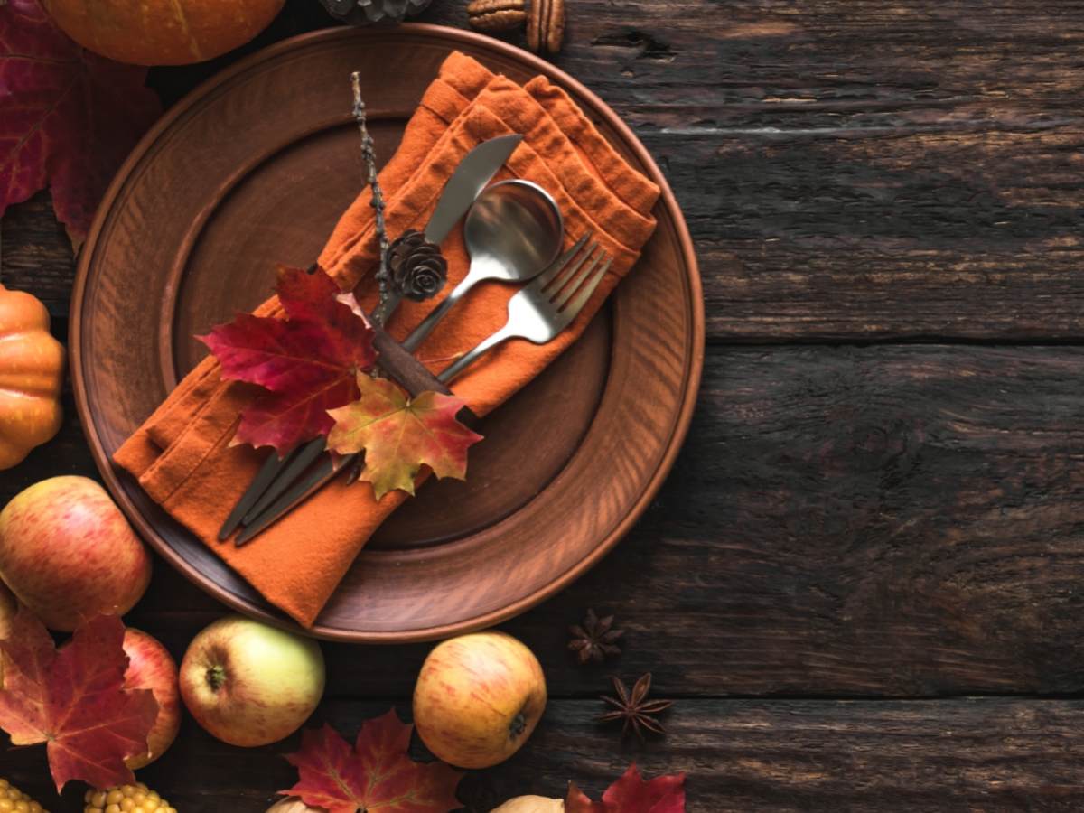 Earthy tones dominate the second photo featuring rustic brown plates and a napkin complemented by vibrant autumn leaves and cutlery evoking the warmth and bounty of the Thanksgiving season in a cozy intimate dining setting