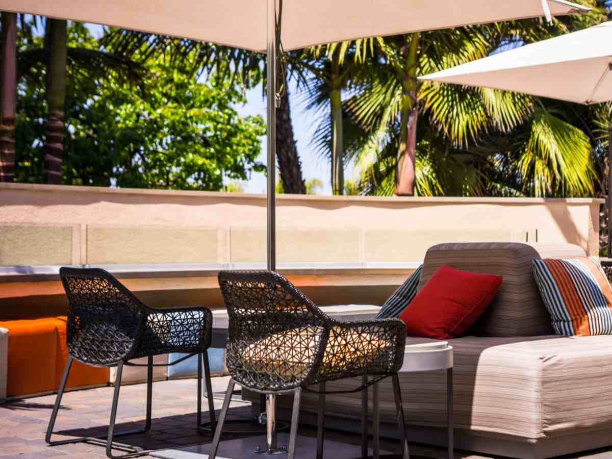 mesh style chairs in hotel outdoor lounge area